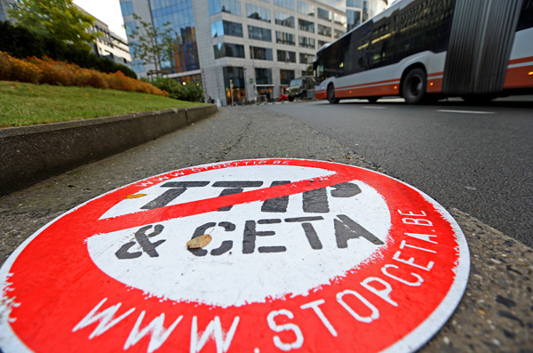 A placard reading ‘STOP TTIP CETA’ is seen outside the EU Council headquarters ahead of a European Union leaders summit in Brussels, Belgium, on Thursday (Reuters photo)